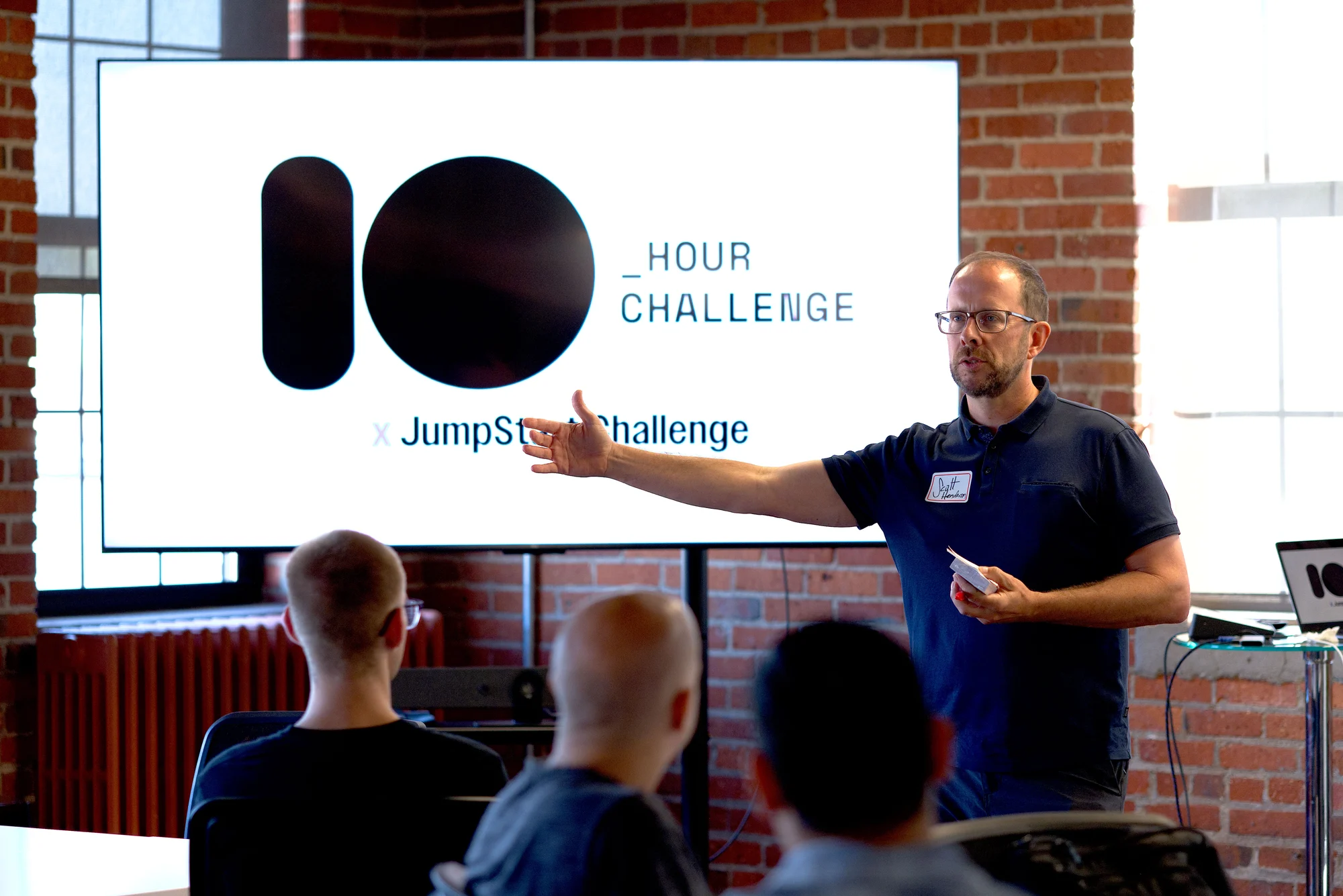 The emcee opening the Ten Hour Challenge